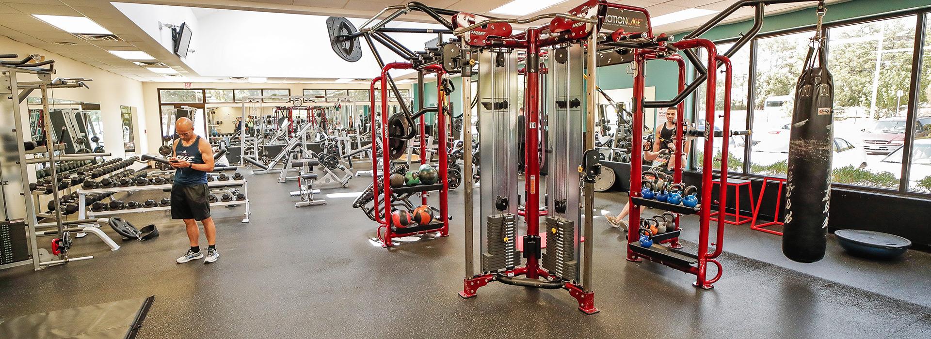 Free weight center at the Mt. Trashmore Family YMCA, including MotionCage, weight benches and racks