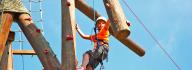 Camper climbing the Alpine Climbing Tower at YMCA Camp Arrowhead in Suffolk, Virginia