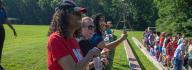 YMCA donors participate in opening ceremony at YMCA Camp Arrowhead