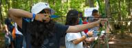 YMCA at Jt's Camp Grom campers show off their archery skills