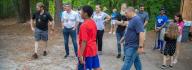 Camp donors observe an activity at YMCA Camp Red Feather