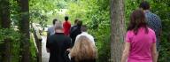 Camp donors walk along the fishing pier at YMCA Camp Red Feather