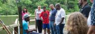 Camp donors gather on the fishing pier at YMCA Camp Red Feather