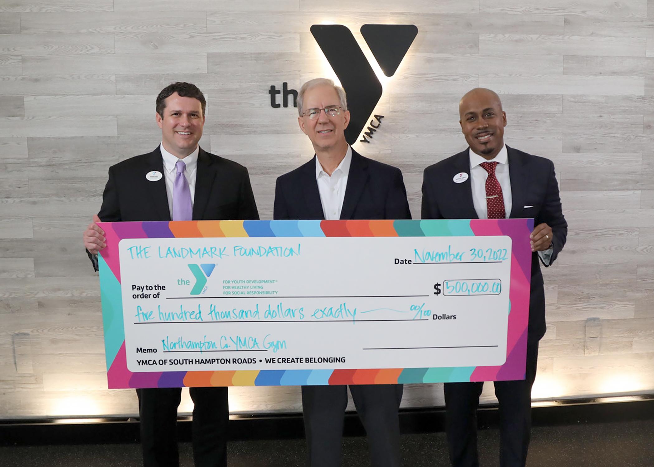 Frank Batten Jr. presents check to Adam Kahrl and Anthony Walters