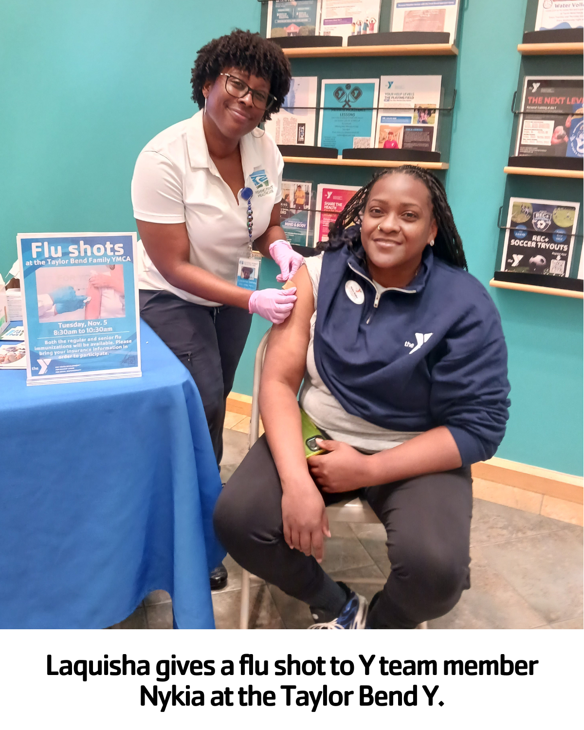 Laquisha giving a flu shot to a Y staff member
