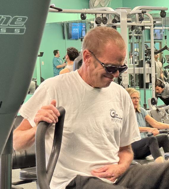 Man with sunglasses in the YMCA fitness center