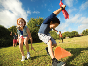Kids playing on the field in sports competition