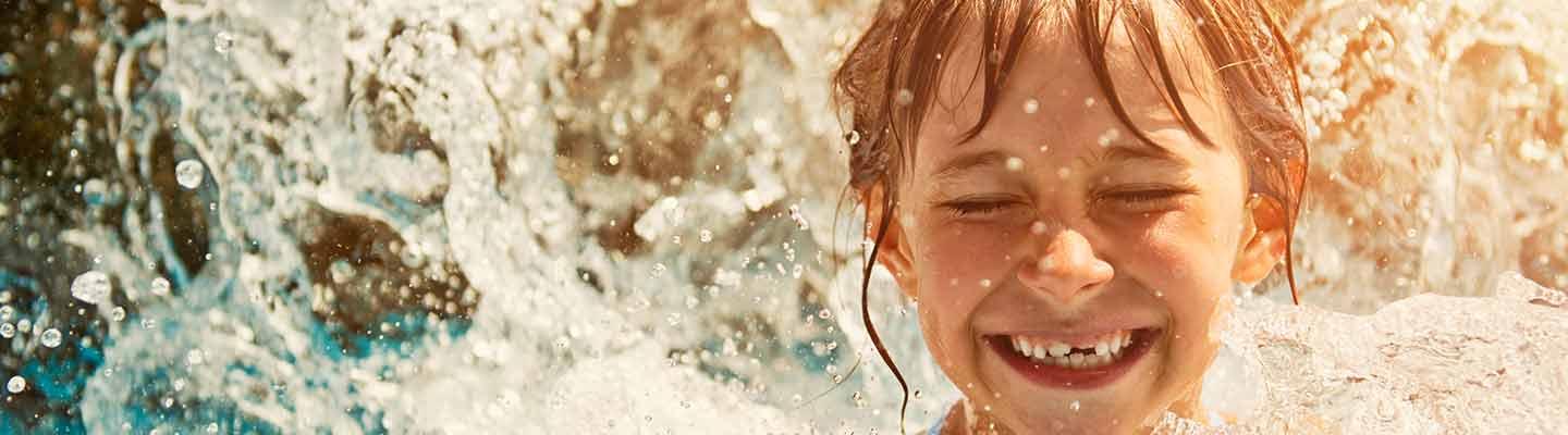 child smiling in water
