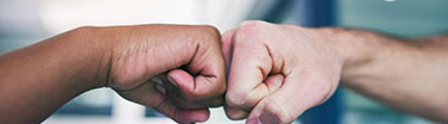 Two fists bumping in celebration