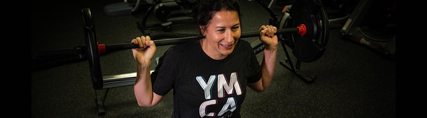 Amelia Baker, Chief Marketing Officer for the YMCA of South Hampton Roads, working out in the fitness center