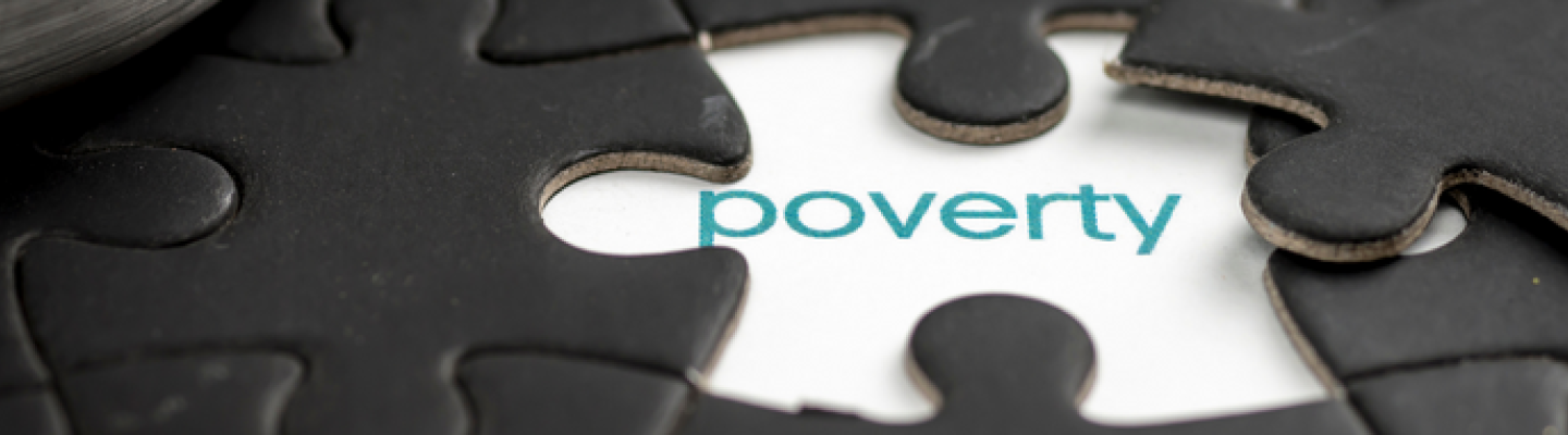 Poverty word inside puzzle pieces