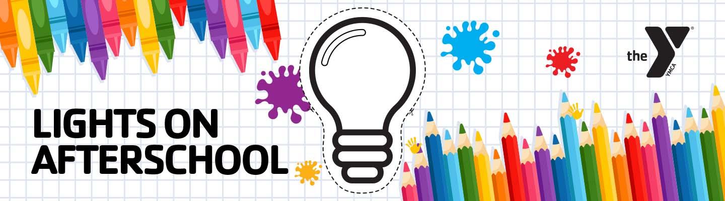 Crayons and colored pencils on graph paper with a lightbulb cut out.