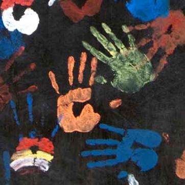 Painted handprints against black background
