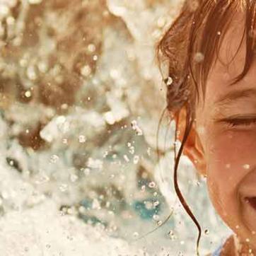 child smiling in water