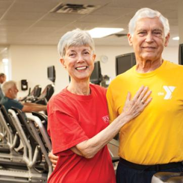Senior couple in the fitness center gym
