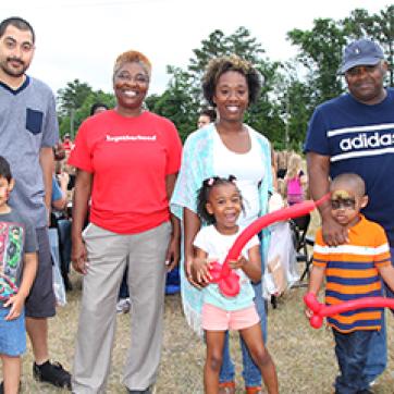 Diverse families at a kids outdoor event Healthy Kids Day YMCA