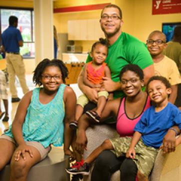 Family with 4 kids in a YMCA lobby