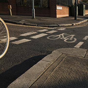 red bicycle on the street in a bike lane