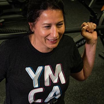 Amelia Baker, Chief Marketing Officer for the YMCA of South Hampton Roads, working out in the fitness center