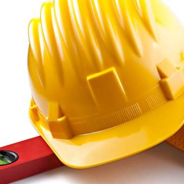 Construction equipment including a level, hard hat, and tool belt 