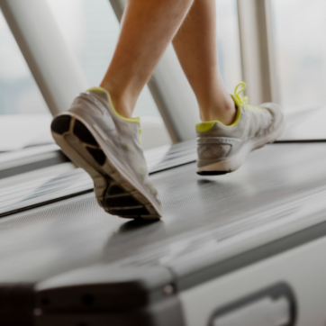 person walking on a treadmill for American heart health month