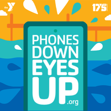 The image of a cell phone that says phones down eyes up dot org, with an orange sky and blue waves in the background.