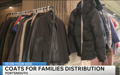 Coats for families in need on a rack at the Portsmouth Family YMCA