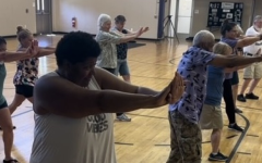 Seniors in the YMCA gym learning defensive techniques