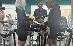 Two YMCA members getting married on treadmills at the Suffolk Family YMCA