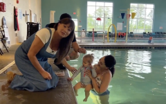 infant swim lessons in an indoor pool at the YMCA