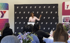 women's symposium speaker at the podium