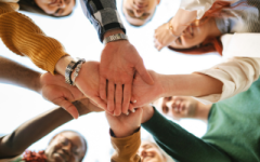 hands in a team circle