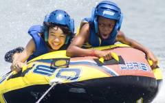 Kids on a jet ski raft