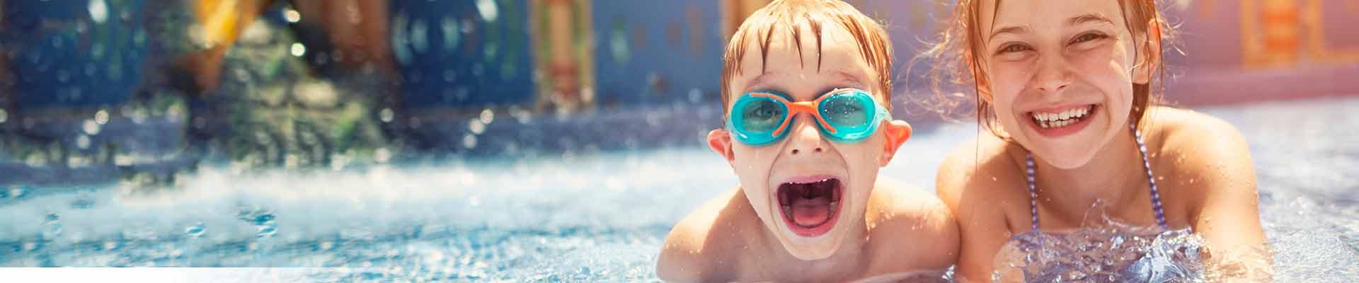 Two kids having fun in the pool at the Y
