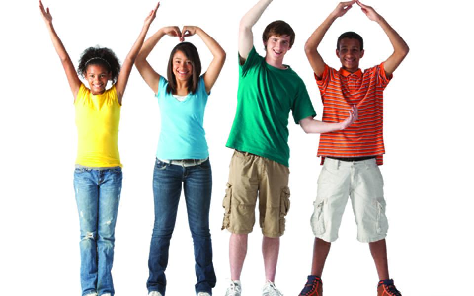 A diverse group of teens forming YMCA with their arms