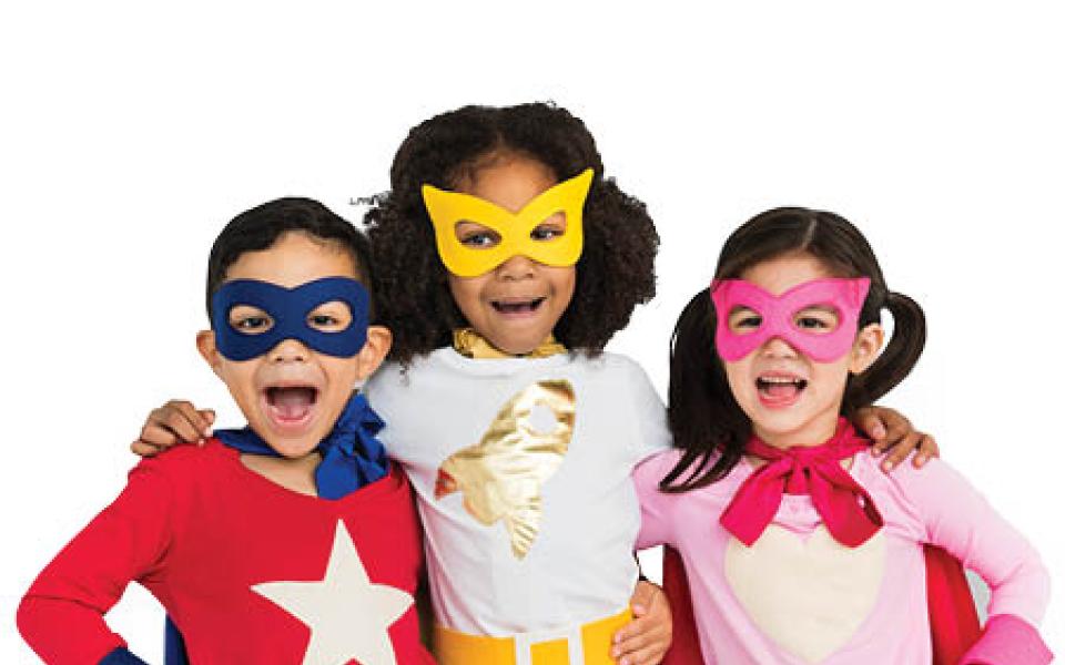 Three friends dressed as superheroes