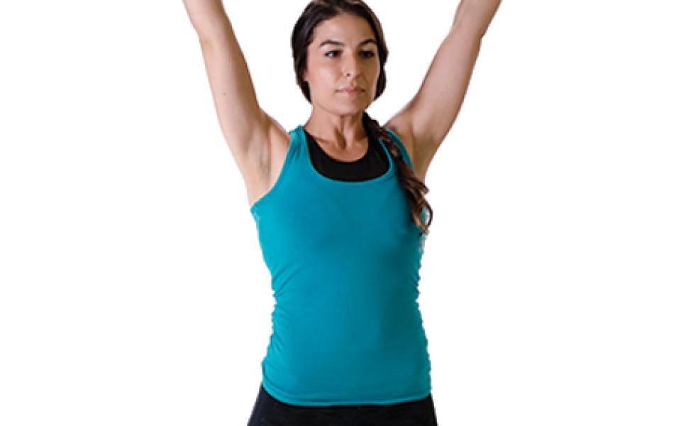 Young woman lifting barbell overhead