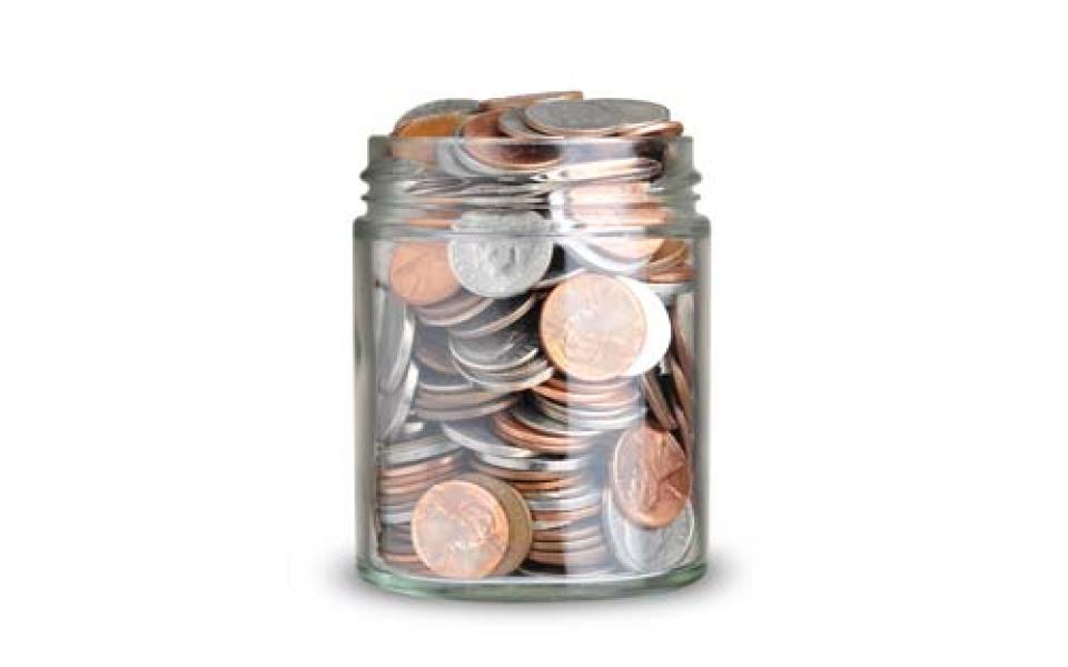 Glass jar full of coins