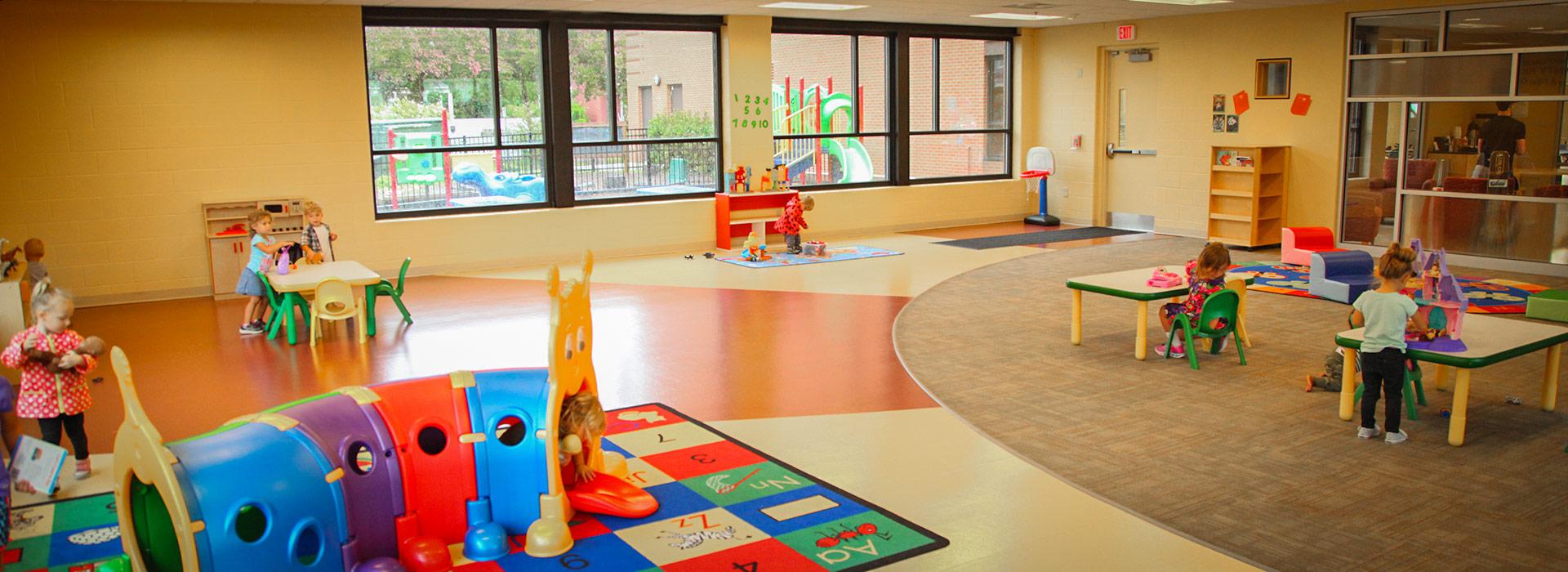 Children playing in the Hampton Roads Community Foundation Stay & Play drop-in child care center at the YMCA on Granby