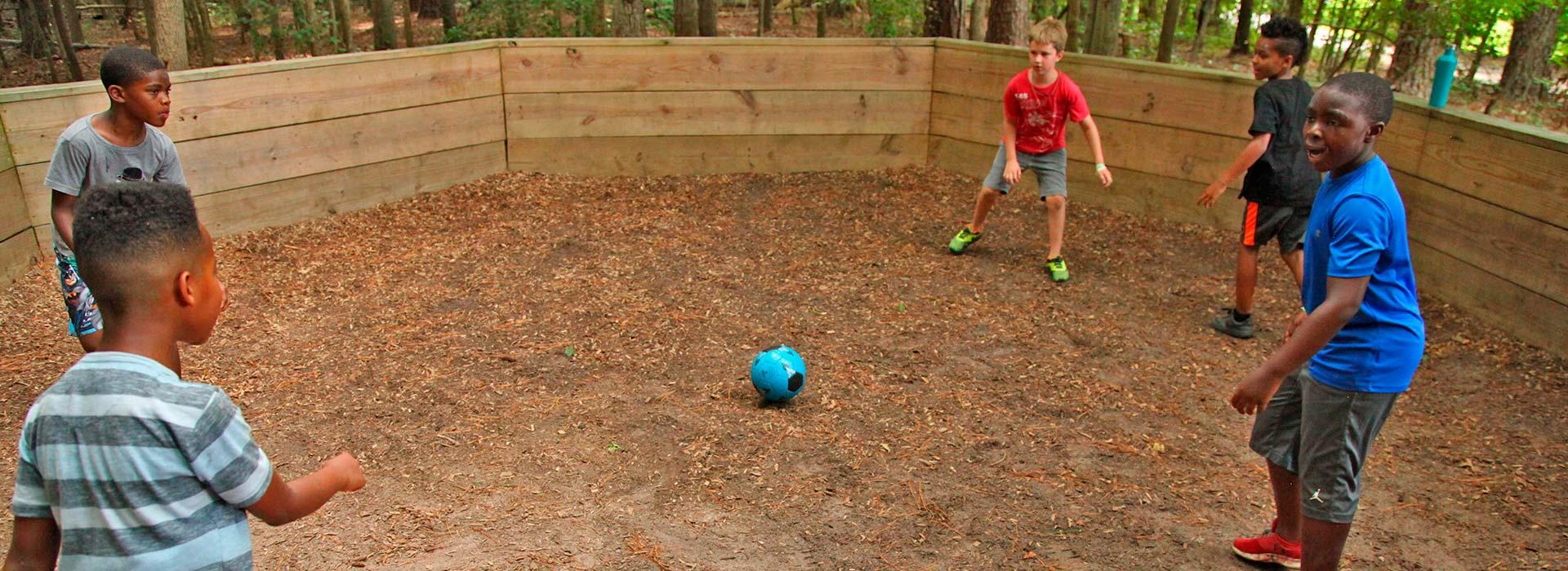 Campers playing GaGa Ball in a GaGa Pit at YMCA Camp Arrowhead in Suffolk, Virginia