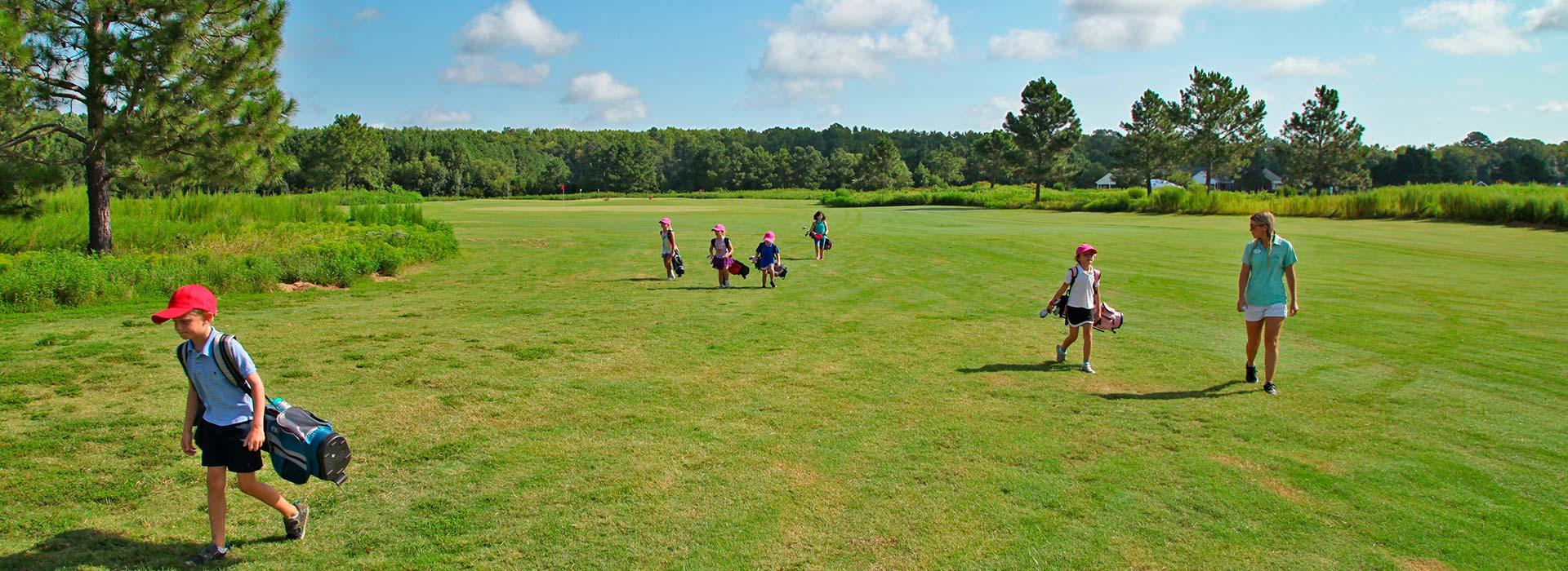 The First Tee of Hampton Roads kids walking with golf gear