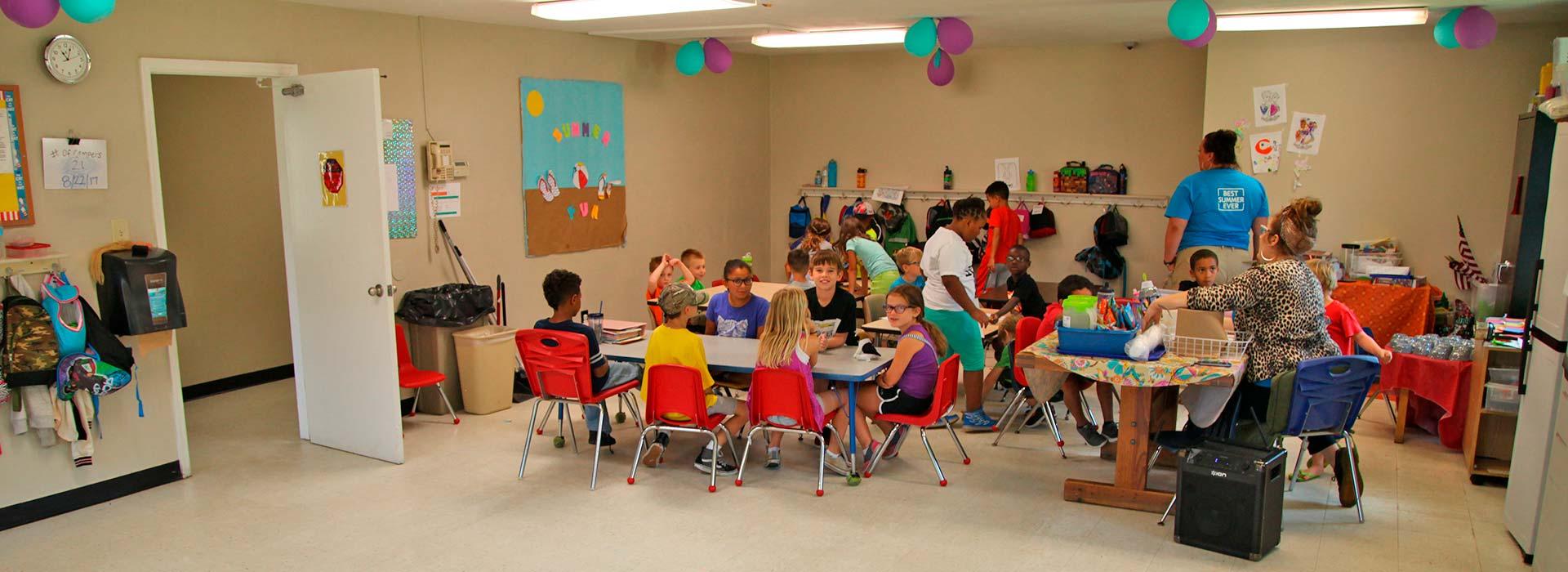 Before & After-School participants in table activity at Salem YMCA Family Center