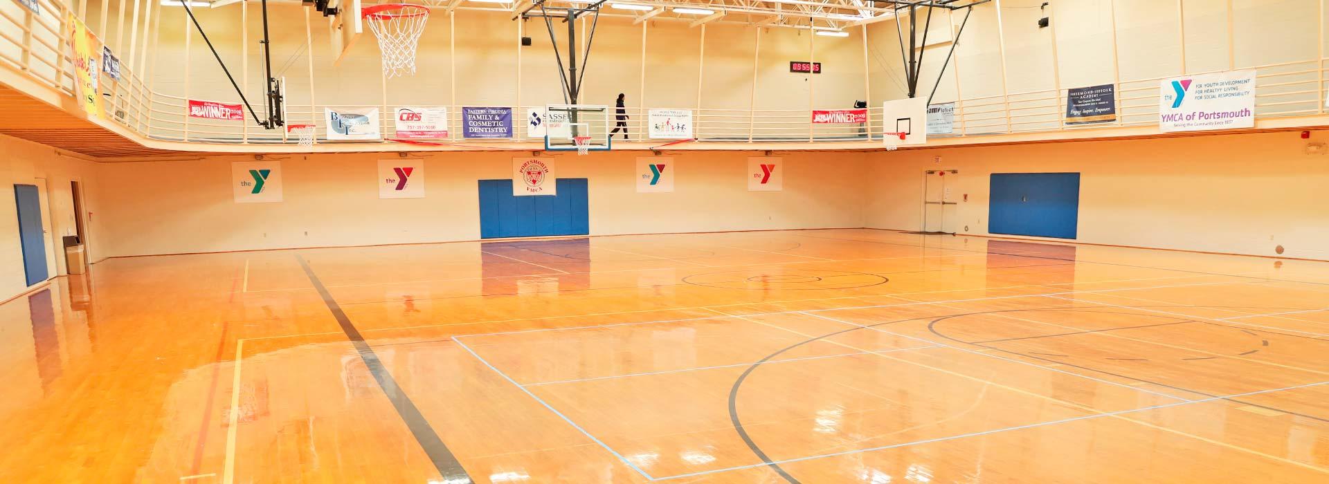 Indoor gymnasium with walking track at the Portsmouth YMCA