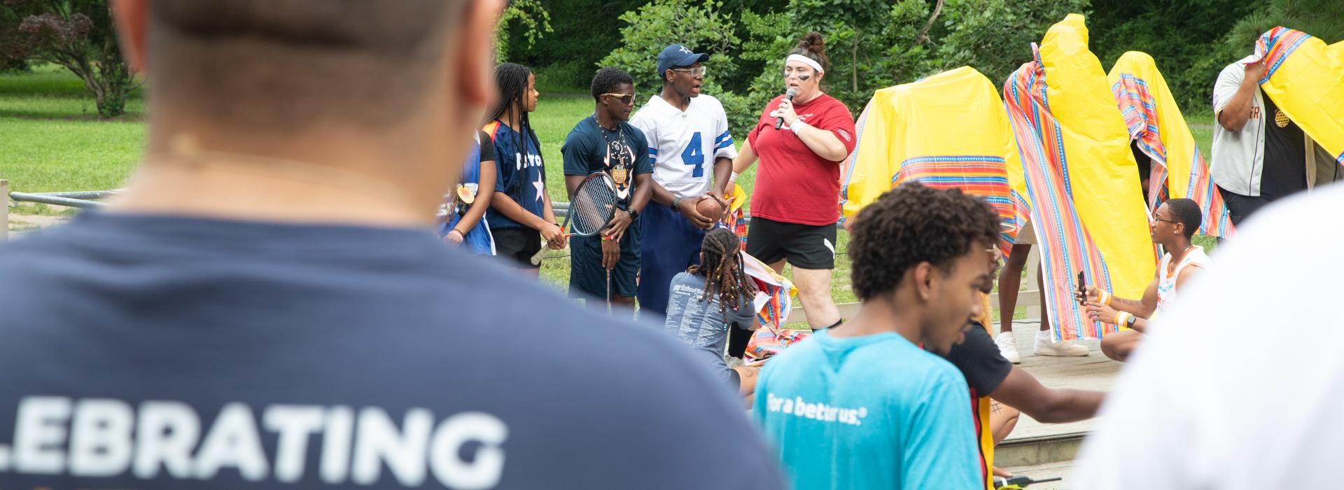 YMCA Camp Red Feather counselor begins opening ceremonies