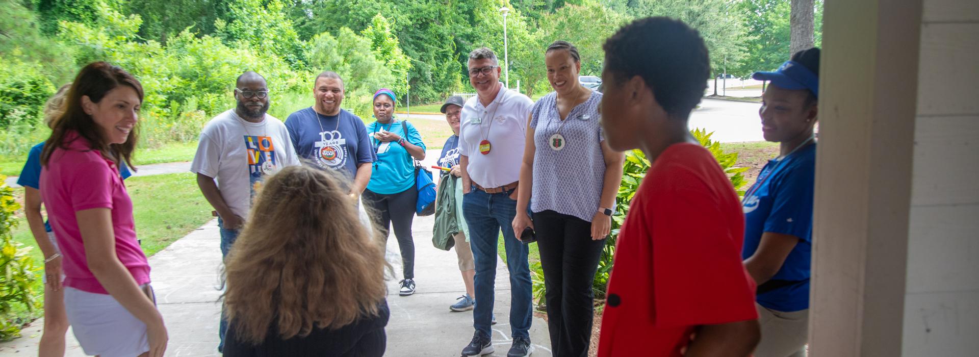 YMCA staff talks with donors about YMCA Camp Red Feather