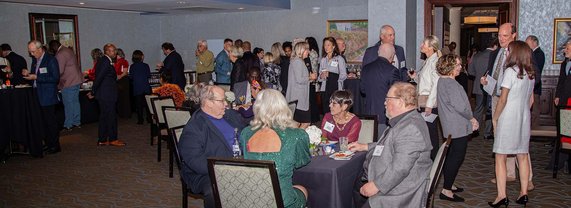 Heritage Society members interact during the 2023 Heritage Society event