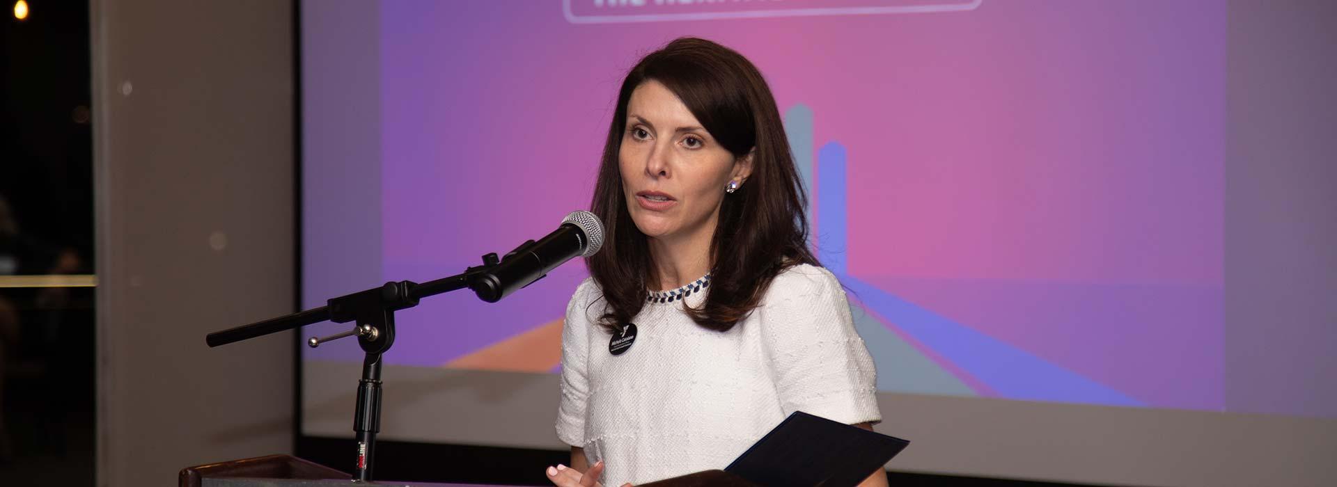 YMCA of South Hampton Roads Chief Development Officer Michele Catalano speaks at the 2023 YMCA Heritage Society event