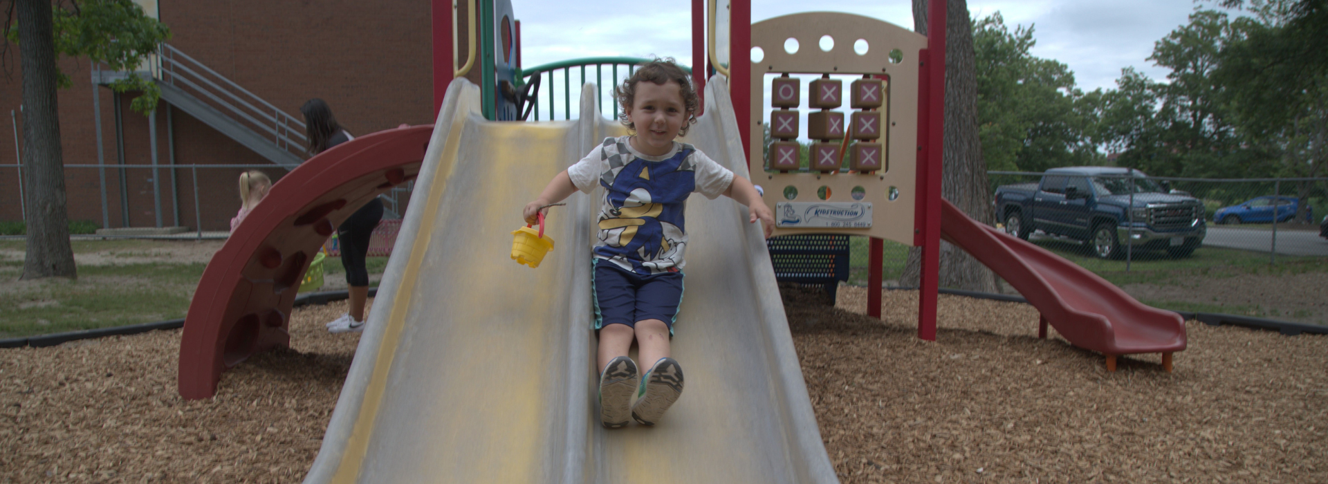 Kids playing on a playground at the Mt. Trashmore Family YMCA preschool