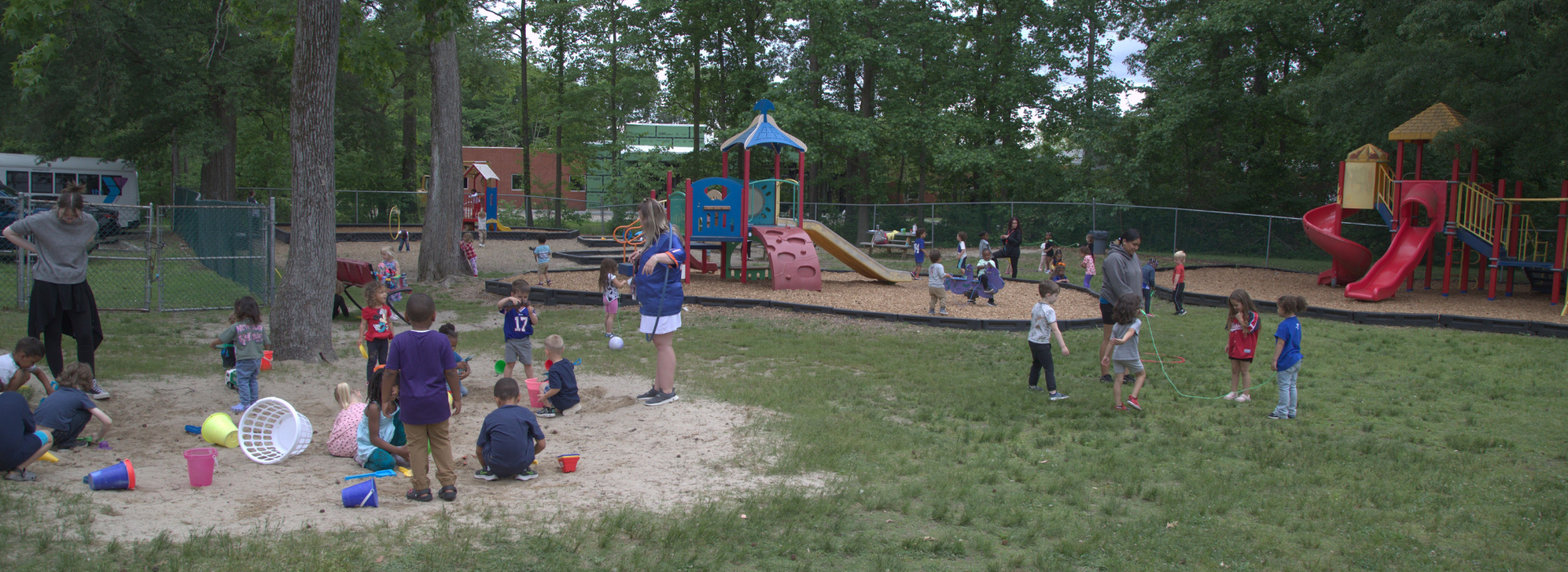 Kids playing on a playground at the Mt. Trashmore Family YMCA preschool