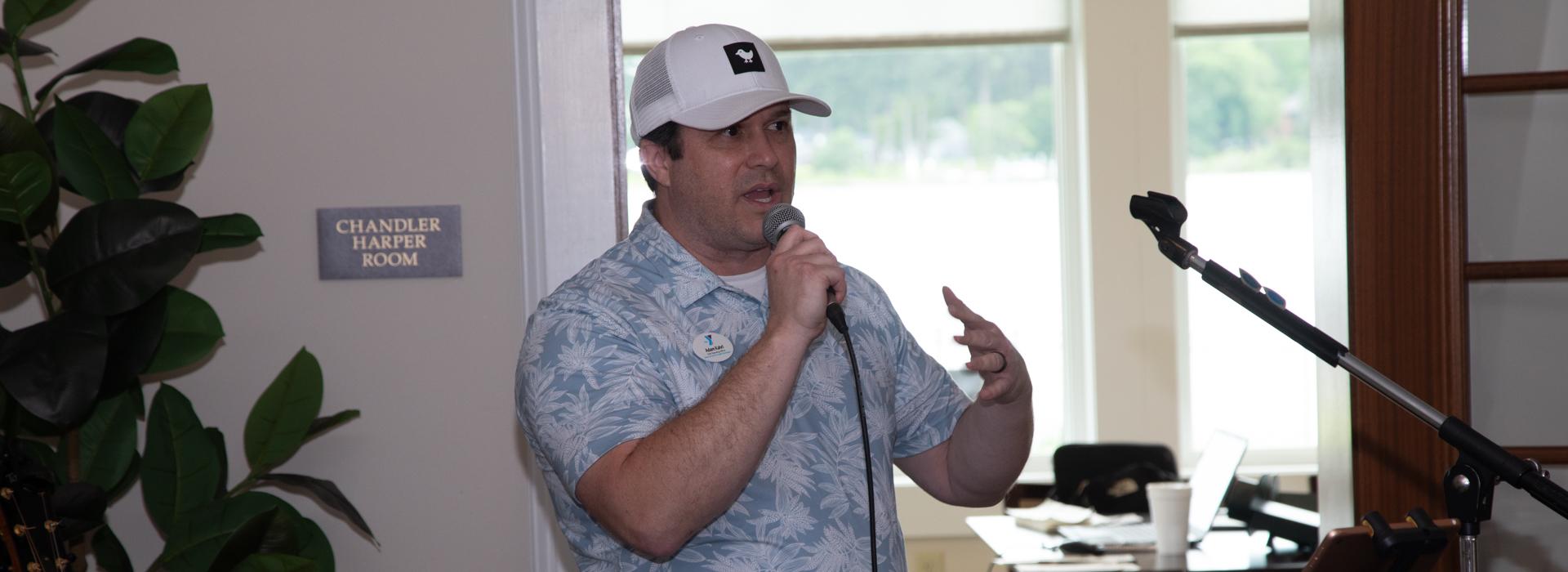 Adam Kahrl, Executive Vice President and COO of the YMCA of South Hampton Roads speaks at the 2024 golf tournament